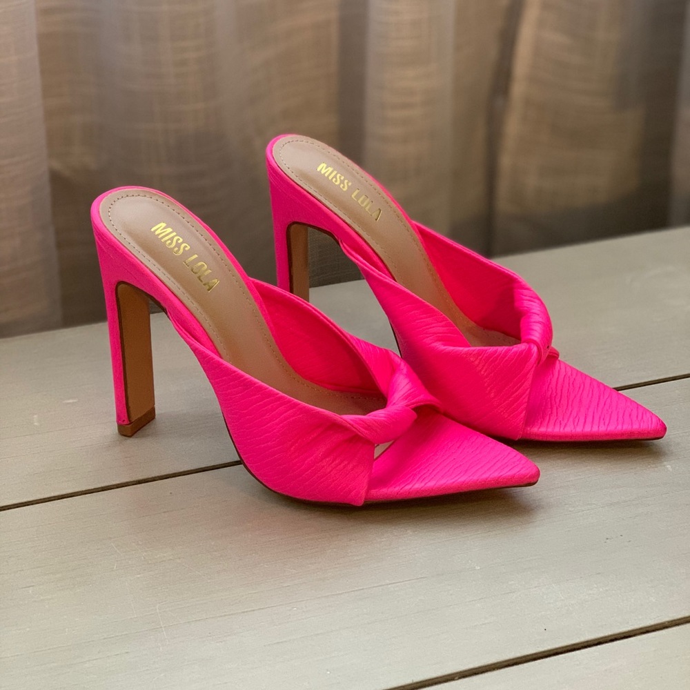 Neon pink high heels. Pointy toe